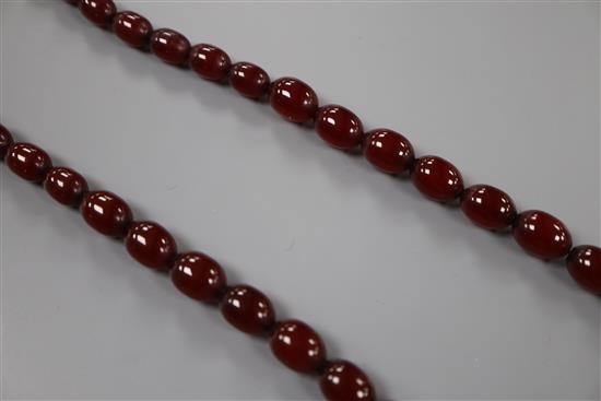 A single strand graduated simulated cherry amber bead necklace, 72cm, gross 61 grams.